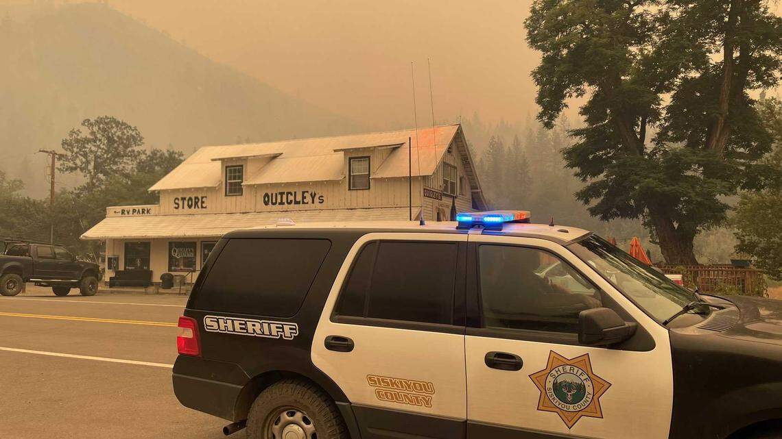 A Siskiyou County Sheriff’s Office patrol vehicle is seen outside of Quigley’s General Store in Klamath River, Calif., on Saturday, July 30, 2022. The McKinney Fire, which sparked Friday afternoon, has burned more than 30,000 acres and prompted evacuations of more than 2,000 residents west of Yreka.