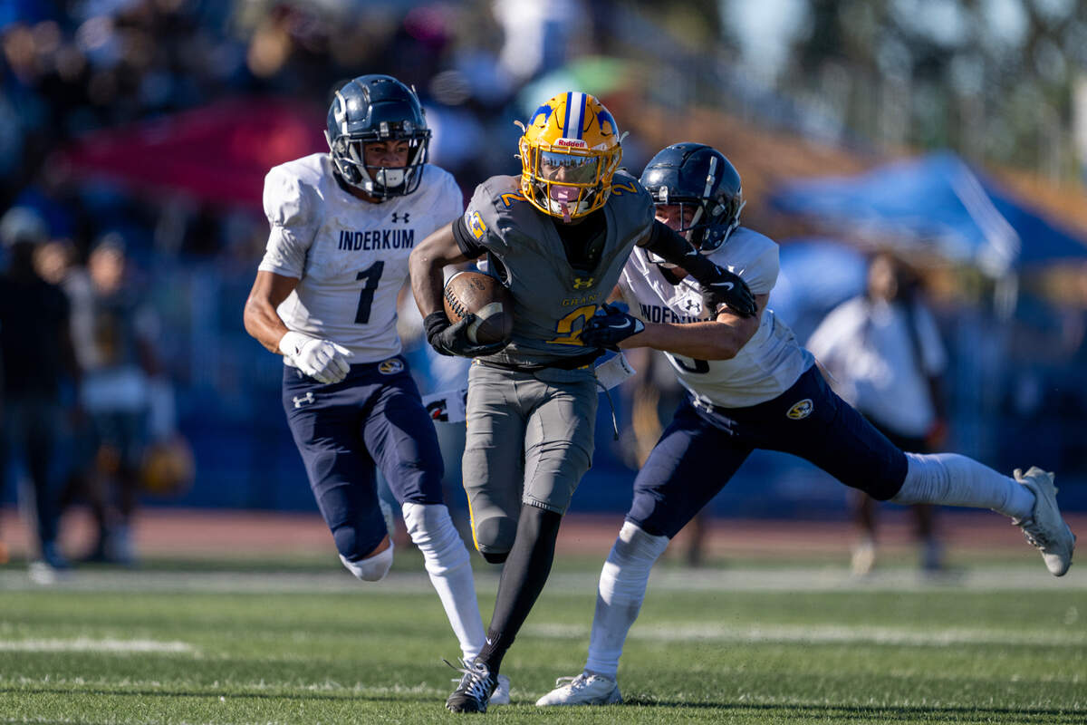 Grant Pacers wide receiver Koby Shabazz (2) escapes the Inderkum Tigers’ JJ Cole (5) and Zayden Maxwell (1) on Sept. 7.
