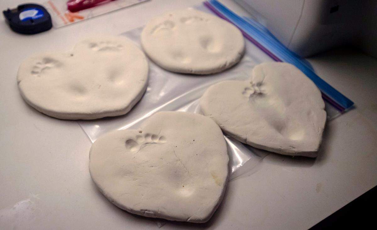 Clay footprints of midwife Madeleine Wisner’s 11-month-old daughter Rosa are set out to dry at Welcome Home Midwifery Services, Inc. in Sacramento on Dec. 9, 2019.