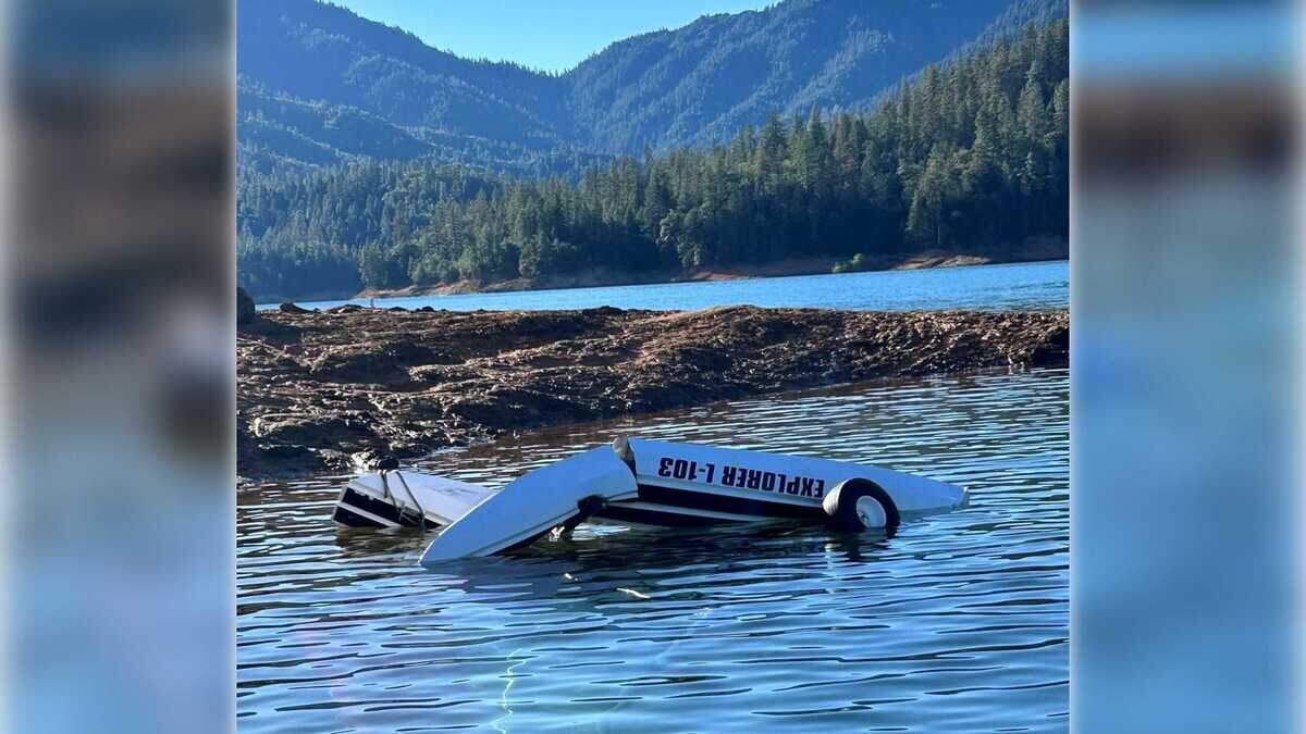 An ultralight Explorer 103 airplane floats upside down in shallow water in the Hirz Bay area of Lake Shasta on Wednesday, June 10, 2026. The pilot was rescued without serious injuries after losing control of the aircraft about 200 feet above the water shortly after takeoff, according to the Shasta County Sheriff’s Office.