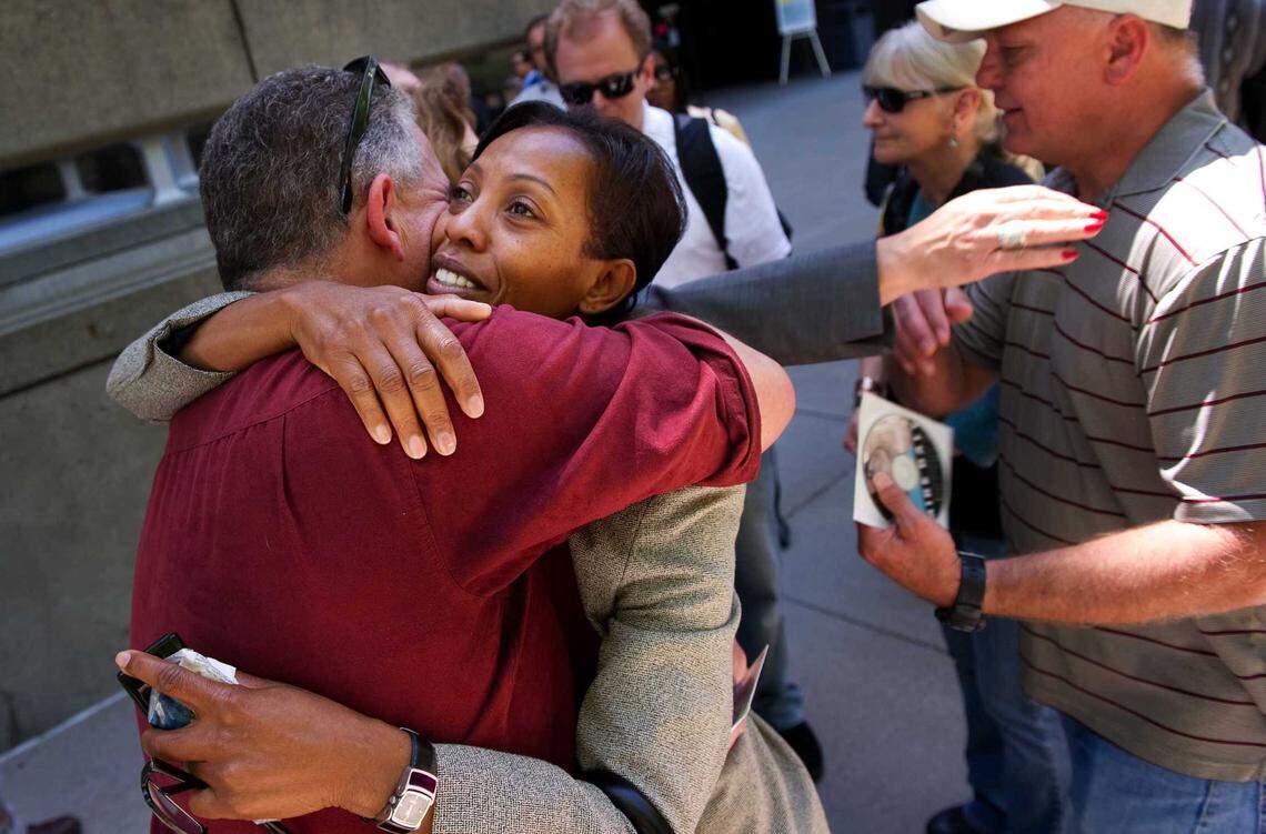 Karen Johnson, wife of murder victim Jon Johnson, hugs jury member Fred Young in 2010 outside the Sacramento Superior Court after the jury recommended that Aaron Norman Dunn be put to death for the 2006 murder of Johnson and John Daly in Elk Grove.