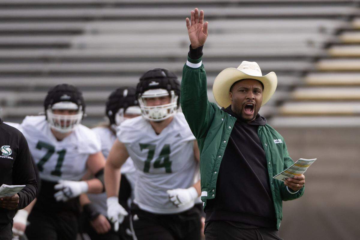 Football coach Brennan Marion leads the team during a spring practice at Sacramento State on Monday, March 17, 2025, in Sacramento. Sac State football as of this week has signed 50 players through the transfer portal, the most nationwide in college football.
