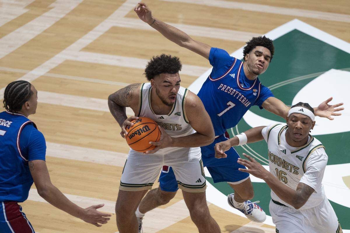 Sacramento State forward Jeremiah Cherry (9) protects the ball from Presbyterian guard Triston Wilson (7) during a game between Sac State and Presbyterian at Hornet Pavilion in Sacramento on Sunday, Nov. 16, 2025.