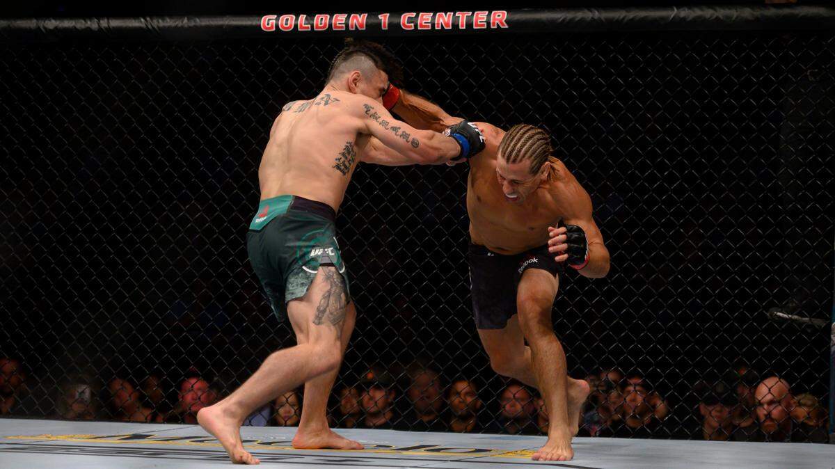 Urijah Faber delivers the fight-ending blow to Ricky Simon during the UFC Fight Night at the Golden 1 Center at the Downtown Commons, Saturday, July 13, 2019.