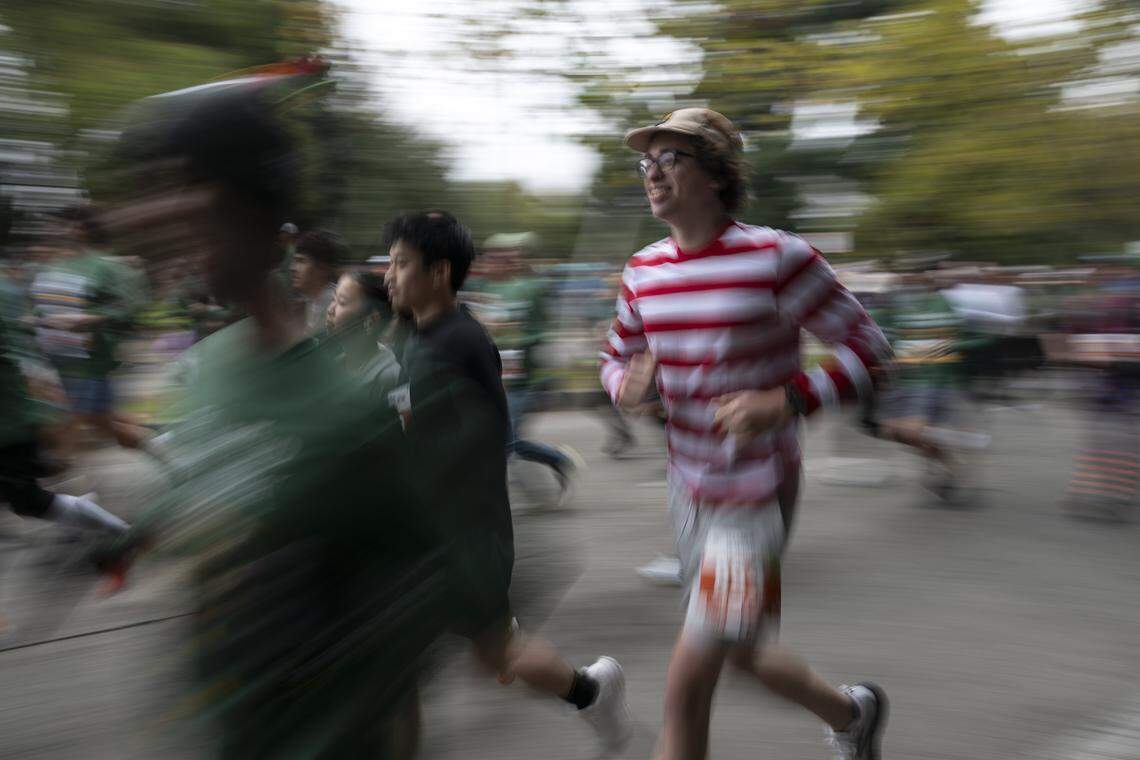 A runner dressed as Waldo runs in the 10k race during the Run to Feed the Hungry in Sacramento on Thursday, Nov. 27, 2025.
