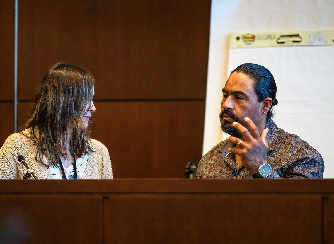 Juan Carlos Reales testifies through an interpreter in the murder trial of his son, Carlos Reales Dominguez, in Yolo Superior Court on Monday. Former UC Davis student Carlos Reales Dominguez is accused of killing two and injuring a third in a series of knife attacks.