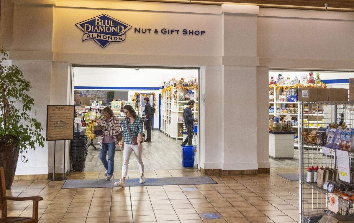 Customers leave the Blue Diamond Nut & Gift Shop on Nov. 11. In April 2026, the store will close and customers will have to visit the Salida store.