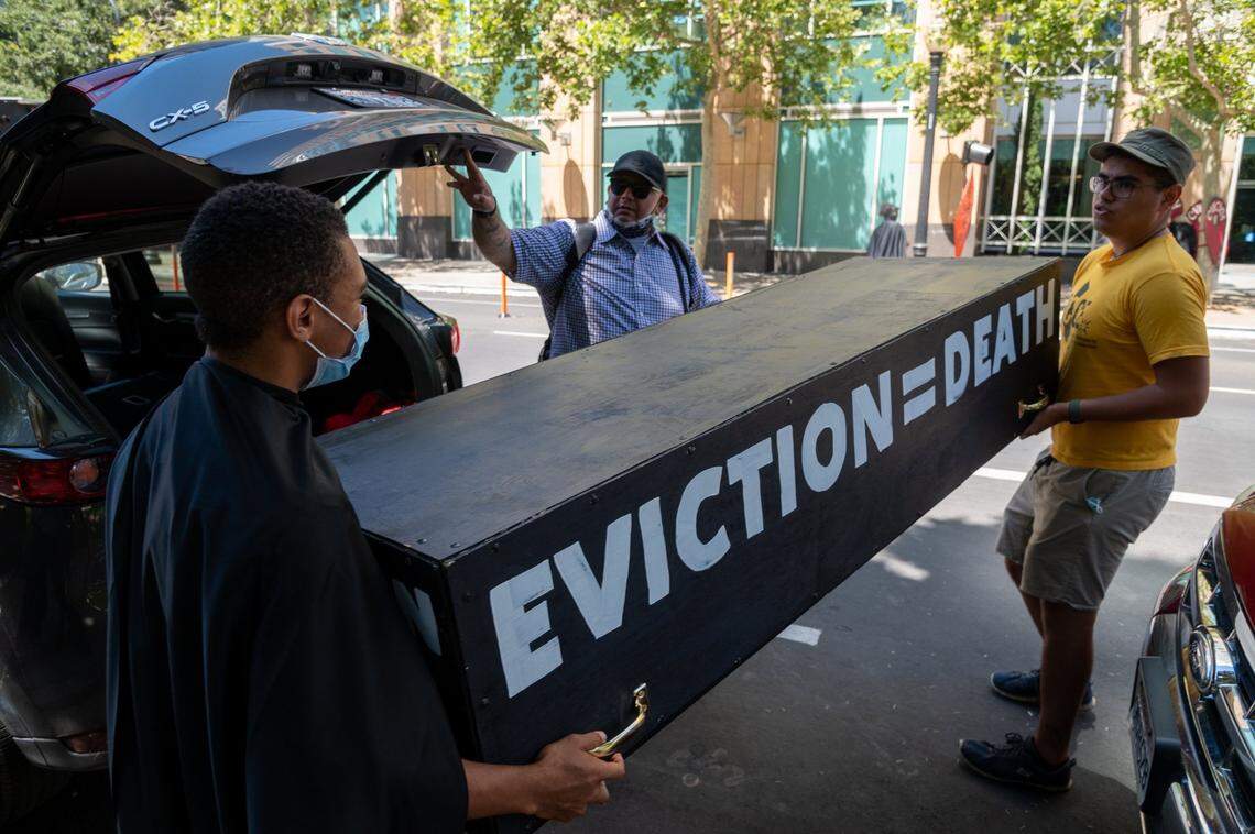 Tenants and advocates carry a casket to protest in front of the California Apartment Associations (CAA) headquarters in Sacramento on Friday, June 25, 2021. Gavin Newsom and state lawmakers struck a deal Friday to extend California’s eviction moratorium until end of September and rent relief program amid COVID pandemic.