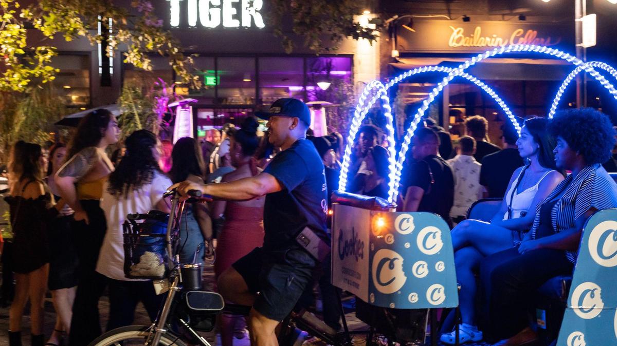 People return to the nightlife scene, as seen outside Tiger Bar and Restaurant on a Saturday night, July 24, 2021, in downtown Sacramento.