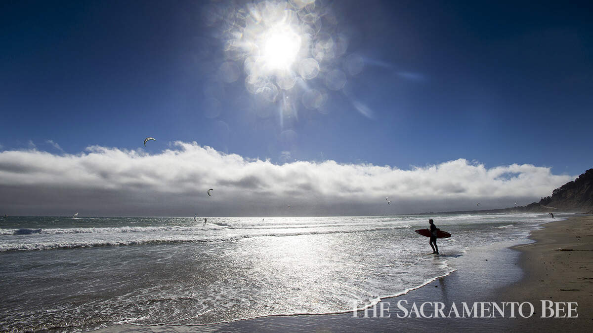 Windsurfers and kiteboarders ride the winds and waves of the Pacific Ocean at Waddell Beach in Big Basin Redwoods State Park, about 20 miles north of Santa Cruz