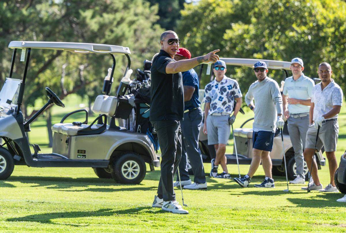 Former Sacramento Kings player Mike Bibby points to photographers as he participates in the third annual Phil Oates Celebrity Golf Classic on Monday at North Ridge County Club in Fair Oaks.
