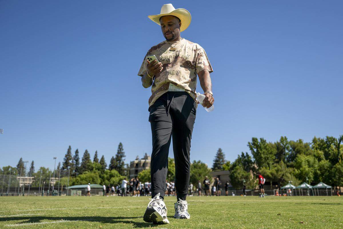 Brennan Marion, Sacramento State's new football head coach, walks off the field after the first practice of the 2025 season in Sacramento on Friday, August 1, 2025.