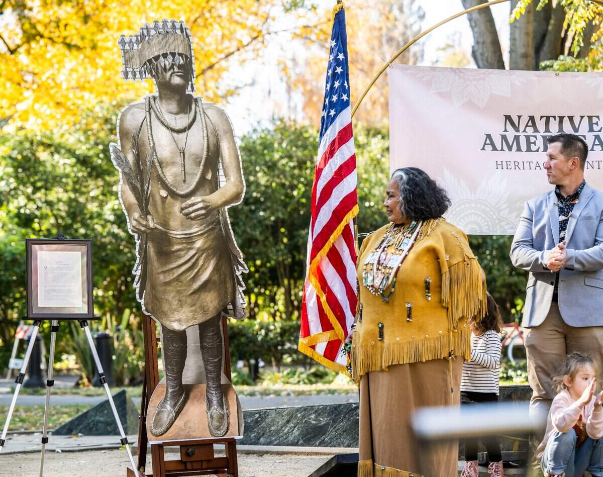 Wilton Rancheria tribal elder Mary Tarango stands Monday, Nov. 14, 2022, near a likeness of Miwok leader William Franklin, who is the inspiration for a Capitol Park monument dedicated to Native Americans that will replace a statue of missionary Junípero Serra that was toppled by protesters in 2020.