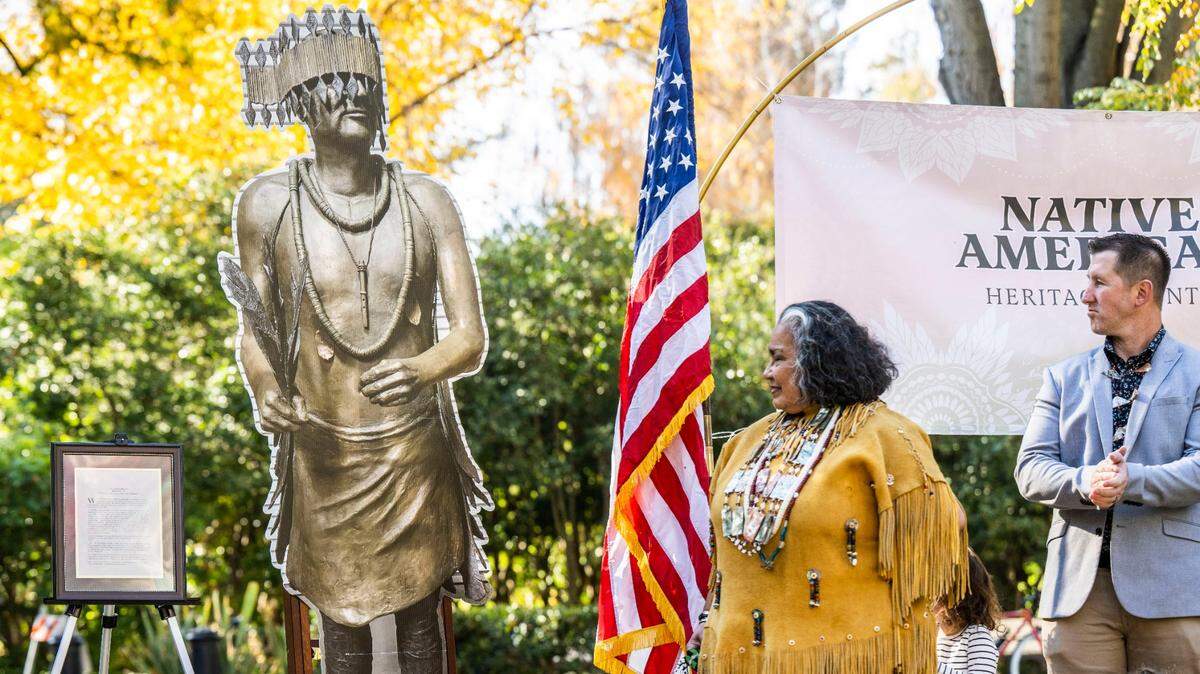 Wilton Rancheria tribal elder Mary Tarango stands Monday, Nov. 14, 2022, near a likeness of Miwok leader William Franklin, who is the inspiration for a Capitol Park monument dedicated to Native Americans that will replace a statue of missionary Junípero Serra that was toppled by protesters in 2020.
