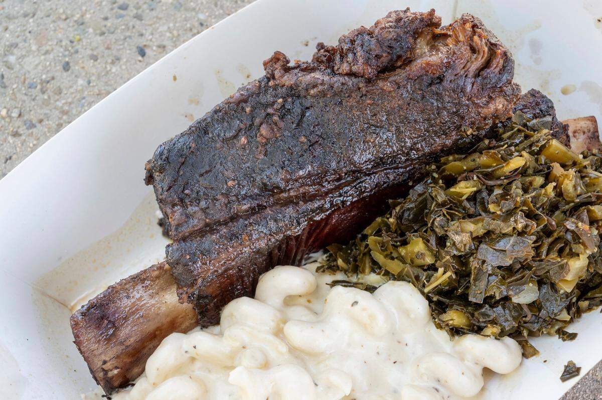 The rib meal with greens and macaroni and cheese is plated from Soul Ona Roll at the California State Fair on Sunday.