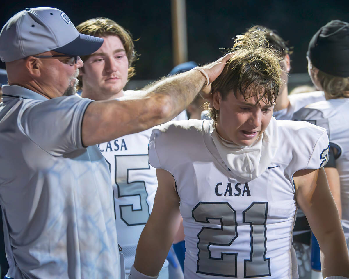 Casa Roble head coach Chris Horner consoles Connor Anderson after their team was defeated by Soquel in the CIF Northern California Division 4-AA championship game in Soquel on Friday.