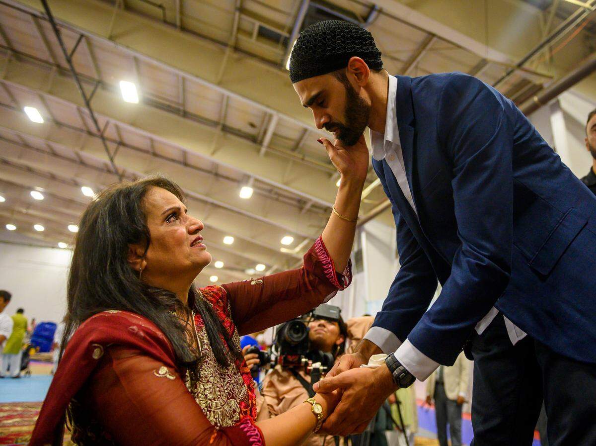 Siddiqa Azam, 60, left, tears ups while holding Hamid Hayat’s face after a press conference that was held after a service during an Eid al-Adha celebration at Jackson Sports Academy in McClellan, Sunday, August 11, 2019. Hayat was convicted on terrorism charges Ñ a federal judge has found him innocent and vacated his case.