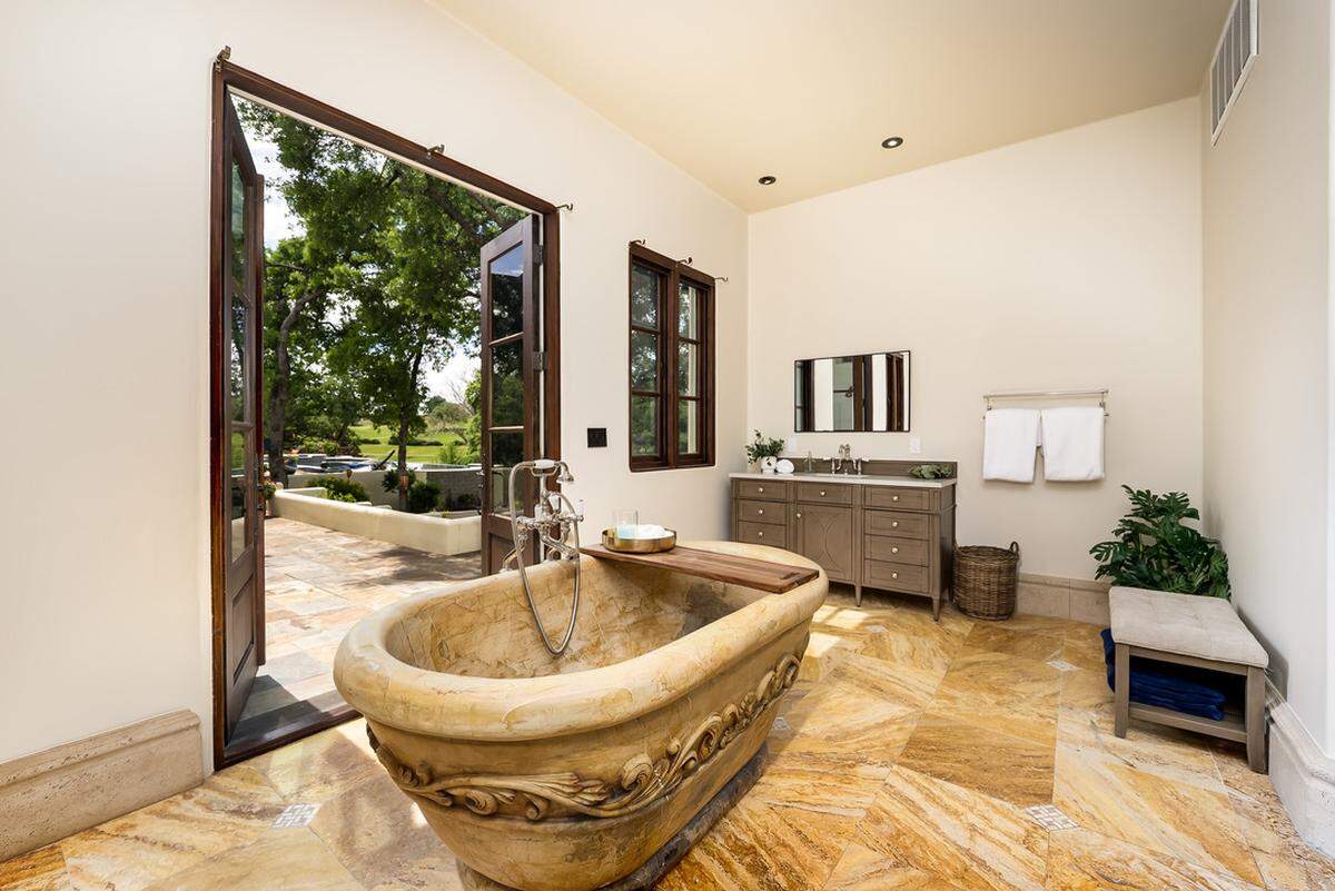 The magnificent luxury stone tub in the primary bathroom was purchased on e-Bay.