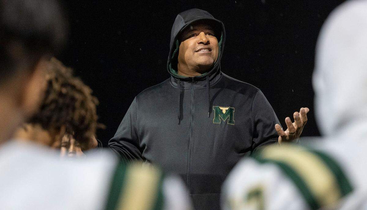 Monterey Trail coach T.J. Ewing speaks to his team after they defeated the Elk Grove Thundering Herd 21-20 to win the Delta League title on Friday, Nov. 1, 2024, in Elk Grove.
