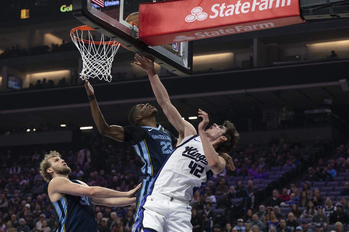 Sacramento Kings center Maxime Raynaud (42) shoots against Memphis Grizzlies forward Cedric Coward (23) during a game at Golden 1 Center in Sacramento on Sunday, Nov. 30, 2025.