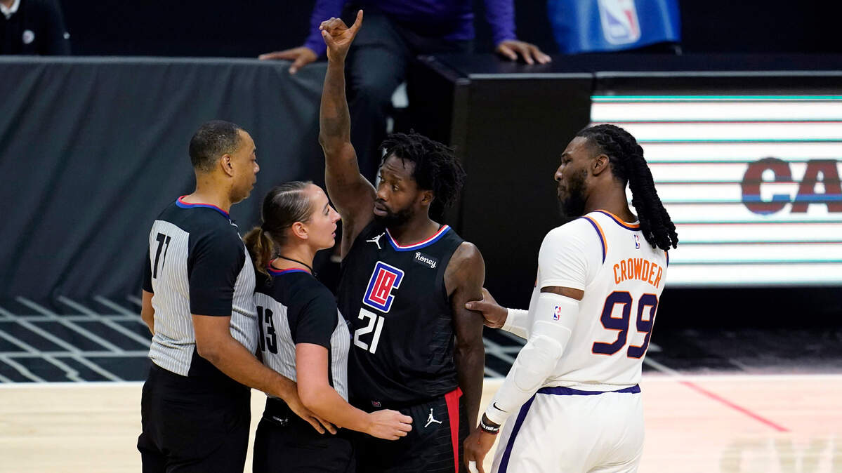 Phoenix Suns forward Jae Crowder (99) grabs Los Angeles Clippers guard Patrick Beverley (21) by the arm after Beverley fouled Suns guard Chris Paul during the second half of an NBA basketball game Thursday, April 8, 2021, in Los Angeles. Beverley was ejected for a flagrant foul. (AP Photo/Marcio Jose Sanchez)