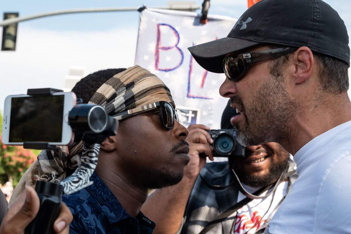 8. Stevante Clark, left, has a heated conversation with Zach Giguiere of Loomis, who said he came out to support All Lives Matter, on Horseshoe Bar Road during a planned Black Lives Matter rally and march, organized by a group of Del Oro High School graduates, on Saturday, July 25, 2020, in Loomis.