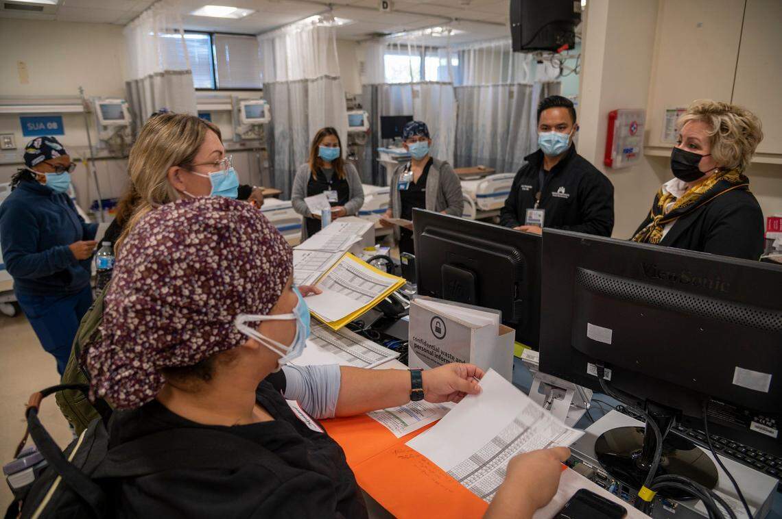 Trish Rodriguez, right, senior vice president at Kaiser Permanente South Sacramento, welcomes visiting nurses Friday that are being trained to work in a cardiac and telementry unit that will open on Monday for non-COVID patients. “I appreciate from the bottom of my heart you being here,” she said. Kaiser worked with the state to provide extra beds in the hospital during the omnicron surge.