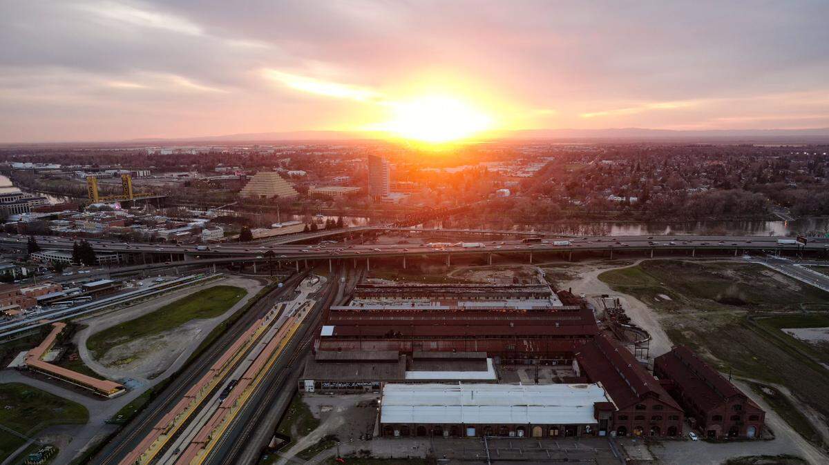A view of the Sacramento’s Railyards development is photographed with a drone at sunset on Tuesday evening, March 2, 2021.