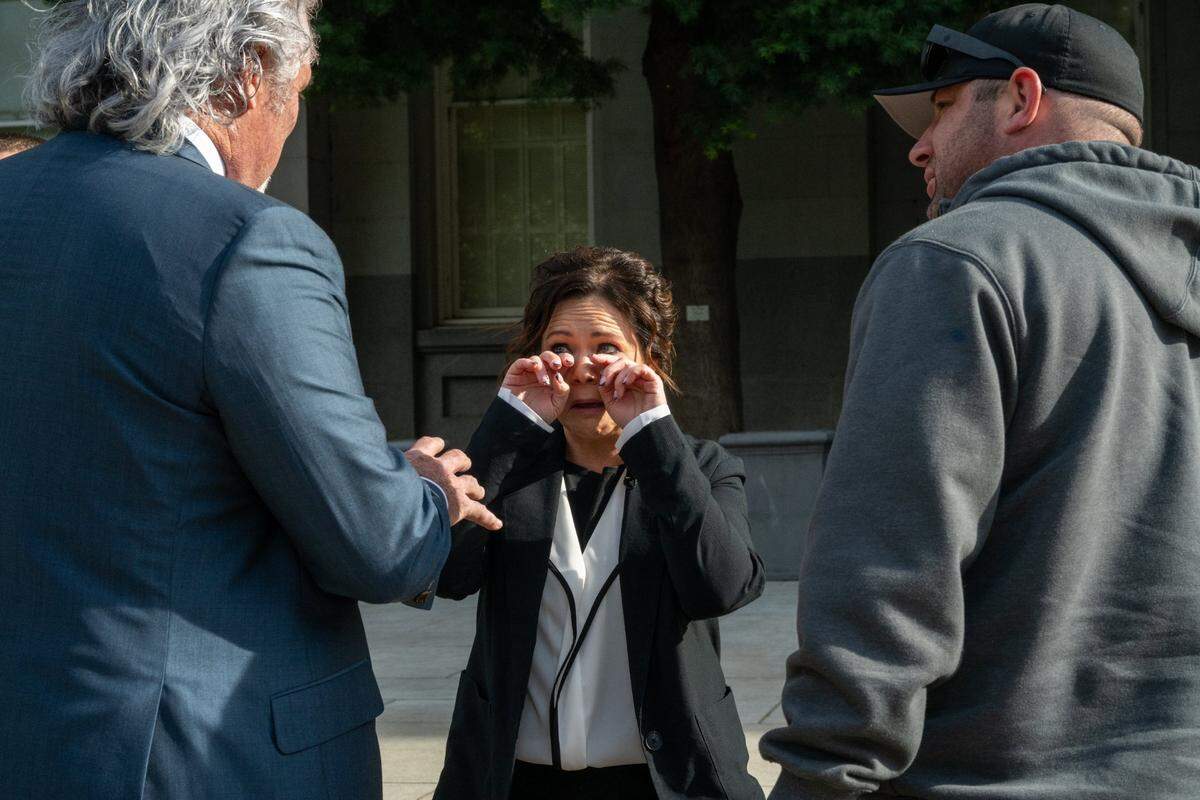 Katie Jackson reacts emotionally Monday after a press conference at the state Capitol, where she described how a prisoner held her hostage and raped her several times while she was working as a correctional officer for the California Department of Corrections and Rehabilitation. Attorney Mark Peacock, who spoke at the press conference announcing that a lawsuit has been filed against CDCR over the incident, stands at left.