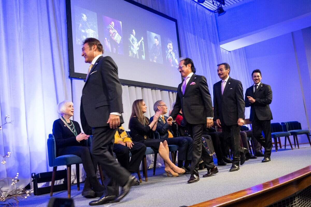 Jorge, Hernan, Raúl and Luis Hernandez of the band Los Tigres del Norte walk to receive their medal during the California Hall of Fame induction ceremony on Tuesday, Dec. 13, 2022 in Sacramento.