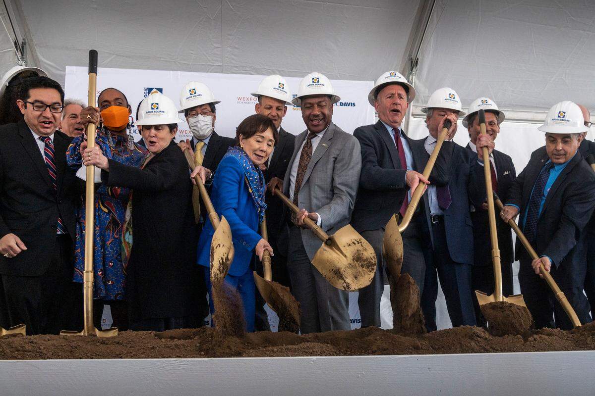 Congresswoman Doris Matsui joins UC Davis Chancellor Gary May, Sacramento Mayor Darrell Steinberg and other elected officials and dignitaries shoveling dirt at a ceremonial ground breaking of the Aggie Square project Wednesday at the UC Davis Medical Center campus in Sacramento.