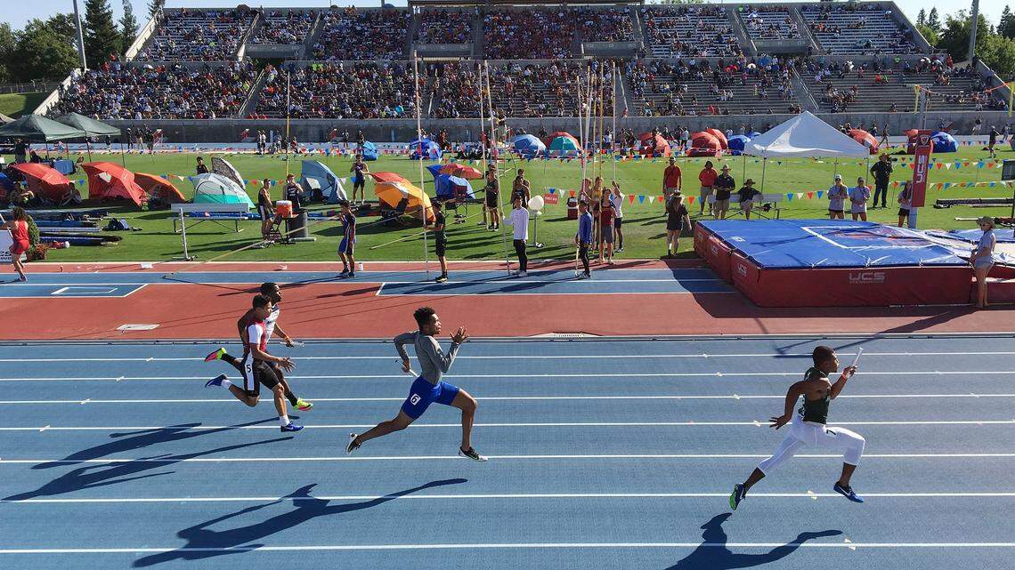 Athletes run in the boys 4x100 relay preliminary event at the CIF State Track and Field Championships at Veterans Memorial Stadium in Clovis on Friday, June 2, 2017.