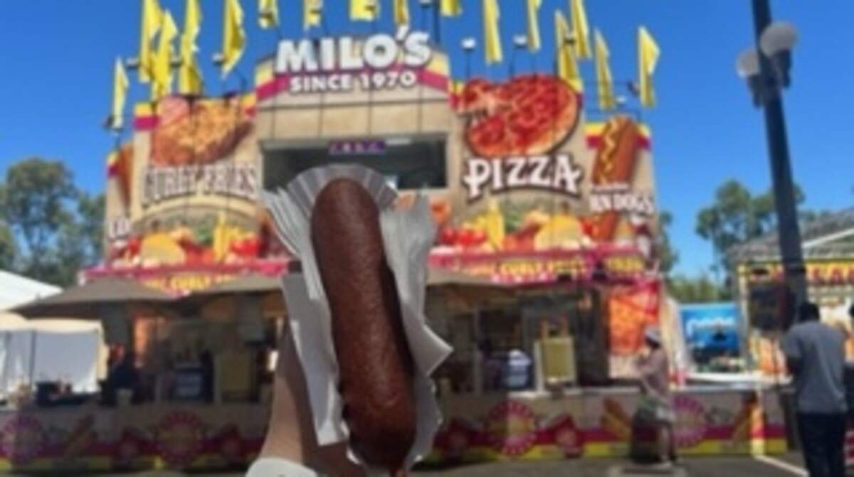 A jumbo corn dog from Milo’s is ready to eat on the State Fair’s opening day 2023.