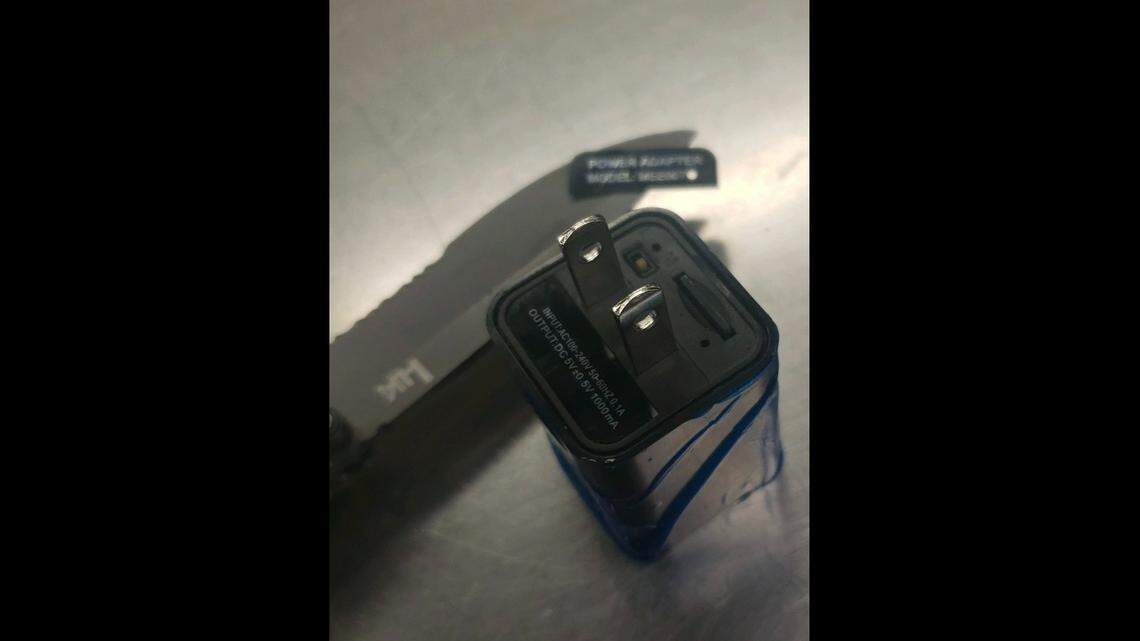 A man was arrested after one of his roommates discovered a camera hidden in a bathroom USB charger, California authorities said. 