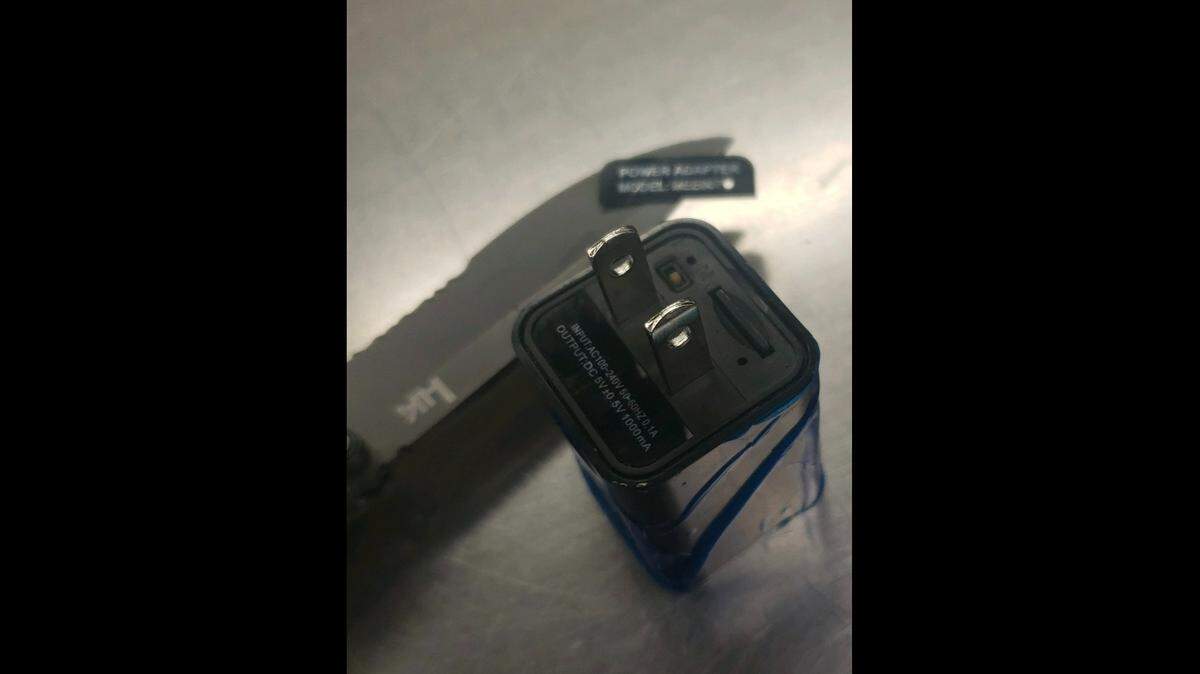 A man was arrested after one of his roommates discovered a camera hidden in a bathroom USB charger, California authorities said. 