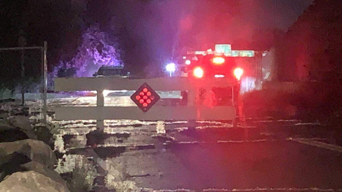 Law enforcement vehicles are seen at the end of China Garden Road in Rocklin in the early morning hours of Monday, July 10, 2023, during authorities search for Eric Abril, 35, a murder suspect who escaped custody at Sutter Roseville Medical Center on Sunday. Officials were working in teams and using K-9s and drones to scour a portion of Secret Ravine, a creek that runs alongside Interstate 80.