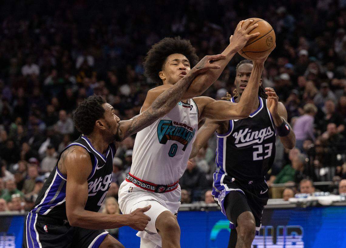 Memphis Grizzlies forward Jaylen Wells drives to the basket as Sacramento Kings guard Malik Monk defends in March at Golden 1 Center. 