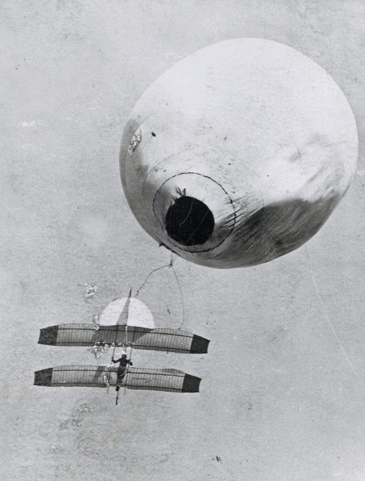 Daniel John Maloney flies in a Montgomery tandem wing aircraft at about 150 from 200 feet off the ground, lifted by Frank Hamilton’s balloon, May 21, 1905, at Old Agricultural Park in San Jose. After the ropes were snapped, Maloney used the controls to land safely.