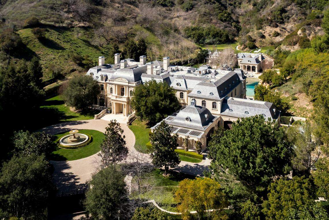 Paris Hilton and Carter Reum have officially purchased 71 Beverly Park, once owned by Mark Wahlberg, for $63 million.