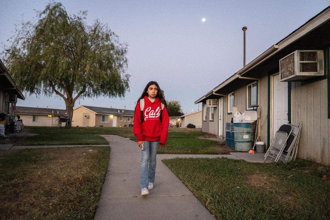 Karla Acevedo Perez leaves her family’s apartment at the Lodi migrant center on her way to school in October.