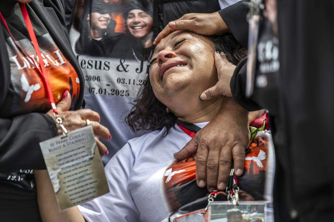 Marisol Hernandez, mother of Esparto fireworks explosion victims Jesus and Jhony Ramos, is comforted as the caskets of her sons are lowered in Greenlawn Memorial Park in Colma on Monday.