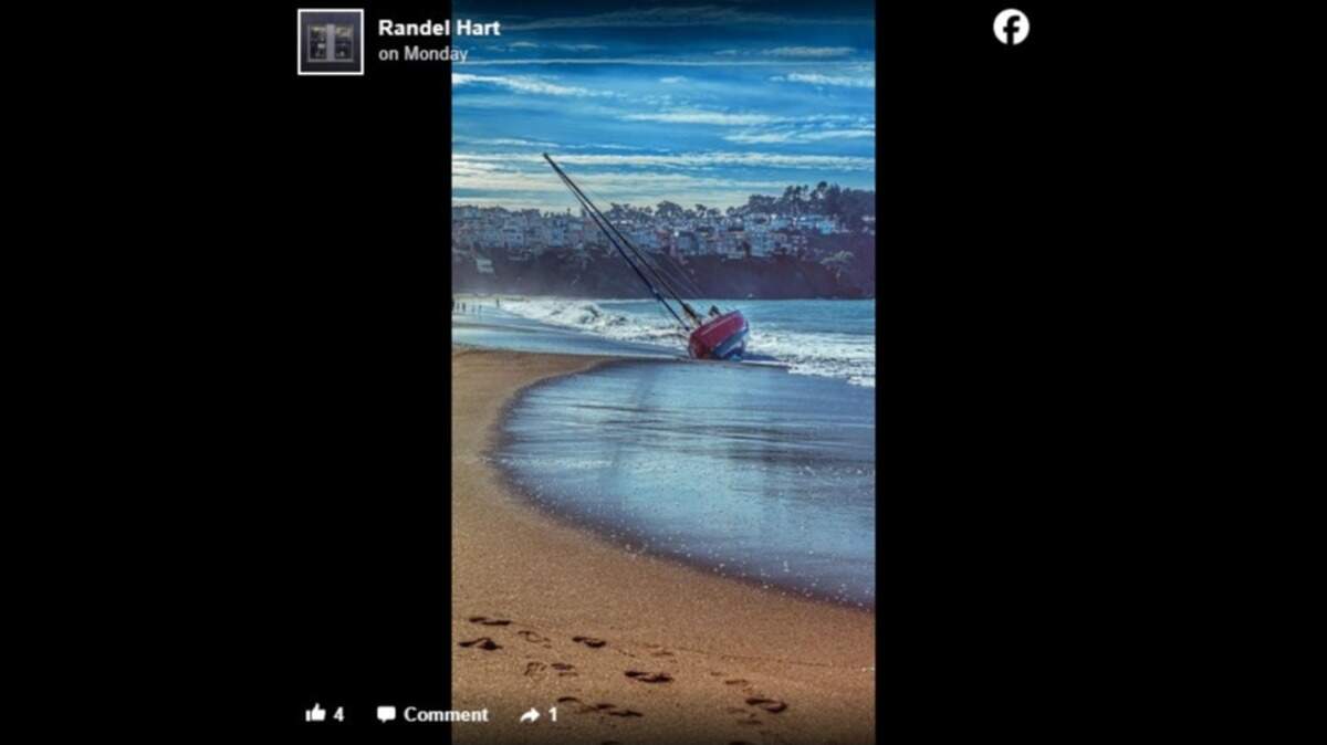 Photos posted online show an empty sailboat washed up on Baker Beach in view of the Golden Gate Bridge in California.