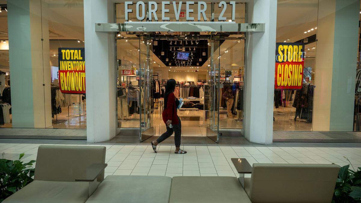 Shoppers walk into the Forever 21 store at Arden Fair mall in Sacramento on Wednesday as it liquidates its merchandise in a Chapter 11 bankruptcy sale. The store is one of two Sacramento-area locations the retailer is closing.