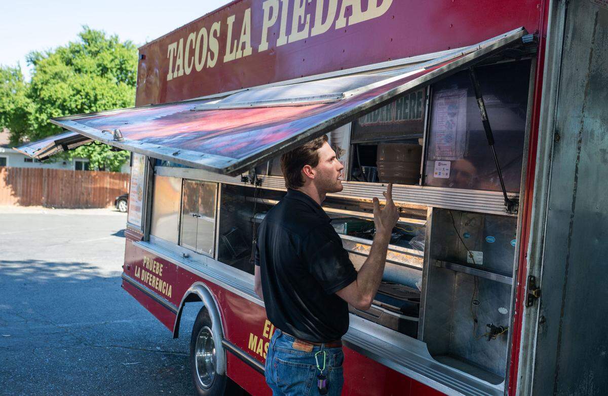 TikTok star Ivan Martinez orders in Spanish from the Tacos La Piedad food truck in Sacramento on Friday, May 9, 2025. His video posts about learning the language through food have earned more than 250,000 followers on the platform.