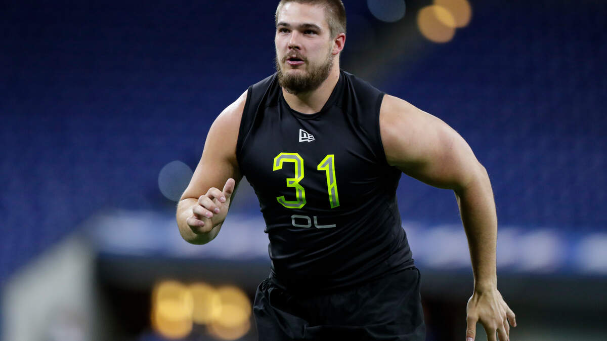 West Virginia offensive lineman Colton McKivitz runs a drill at the NFL football scouting combine in Indianapolis.