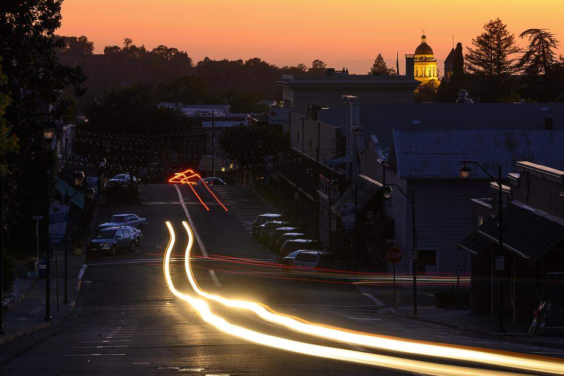 The historic Placer County Courthouse shines above a dark Auburn after PG&E turned off power to prevent fires due to high winds in 2019.