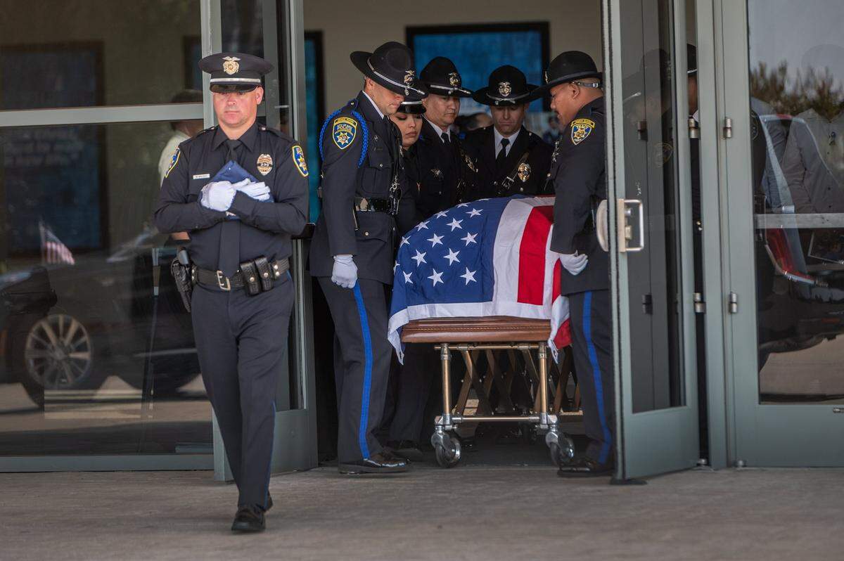 Pallbearers from the Galt, Stockton and Tracy police departments escort the body of Galt Officer Harminder Grewal from Bayside Church’s Adventure Campus in Roseville to the hearse after his memorial on Monday Sept. 13, 2021. Members of the Sikh community and police officers as far as New York attended the service. Grewal died from injuries when his patrol car was struck head-on by a pickup truck on Highway 99, near Dillard Road.