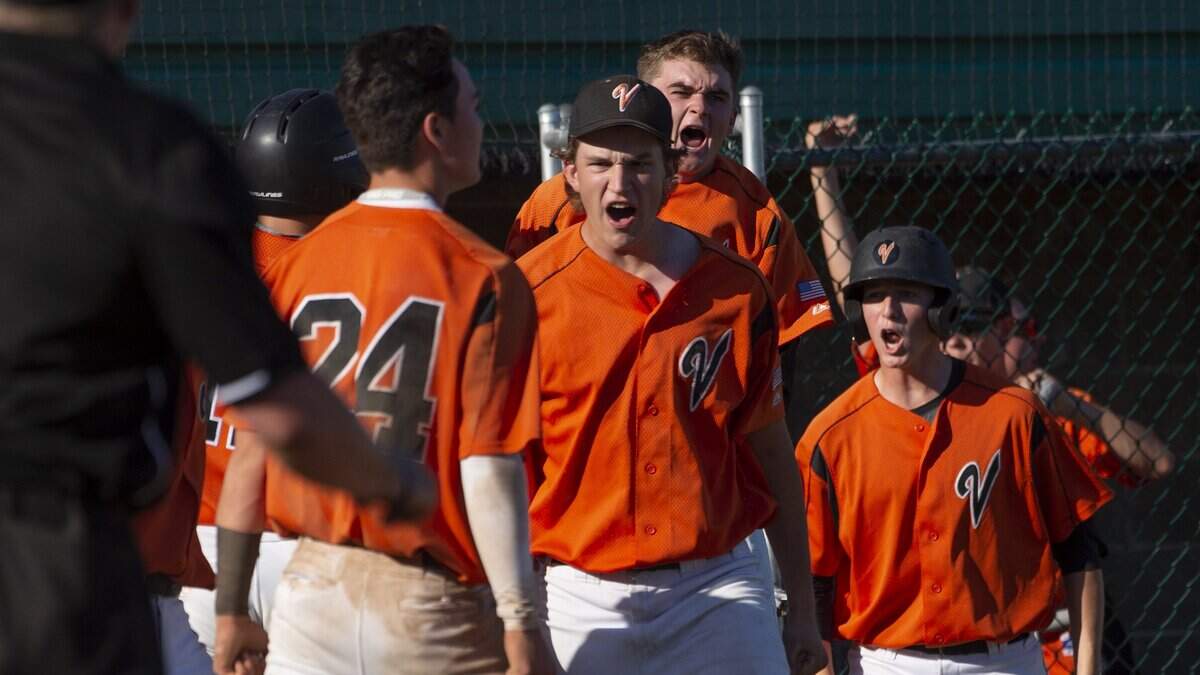Vacaville players celebrate a bases-loaded triple during the Sac-Joaquin Section Division I finals on May 28, 2018, at Sacramento City College. The Bulldogs are back at Union Stadium trying to repeat. Vacaville plays Jesuit in the final at 4 p.m. May 27.