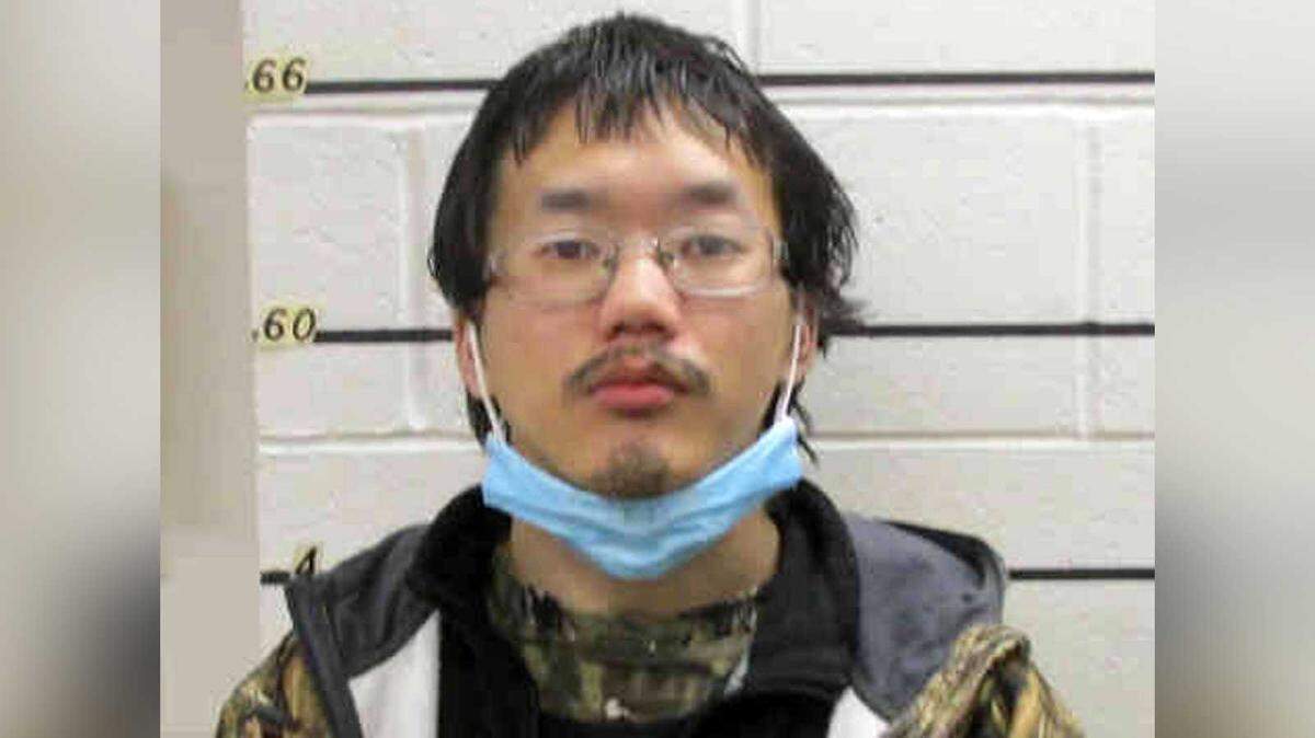 Kuachua Brillion Xiong is seen in a booking photo following his 2021 arrest. The former resident of Sacramento and Merced was charged with threatening to kill or kidnap the president and vice president. He was sentenced Tuesday to two years in prison.