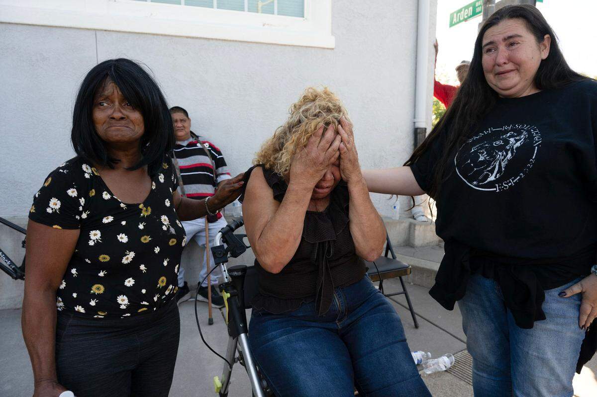 Betty Edwards, 60, center, who goes to dialysis three times a week, breaks down in tears watching the city of Sacramento remove Camp Resolution on Monday. “I want my home back – don’t take my home,“ she cried hysterically. Sacramento Homeless Union President Crystal Sanchez, right, said it was heartbreaking watching people lose their homes.